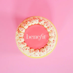 2 Tier Corporate Drip Cake with logo featuring pink Swiss Meringue icing and edible logo plaque by Crumbs & Doilies.